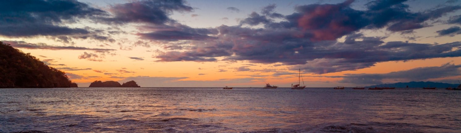 Rondreis Costa Rica, Playa Hermosa, strand met zonsondergang, banner