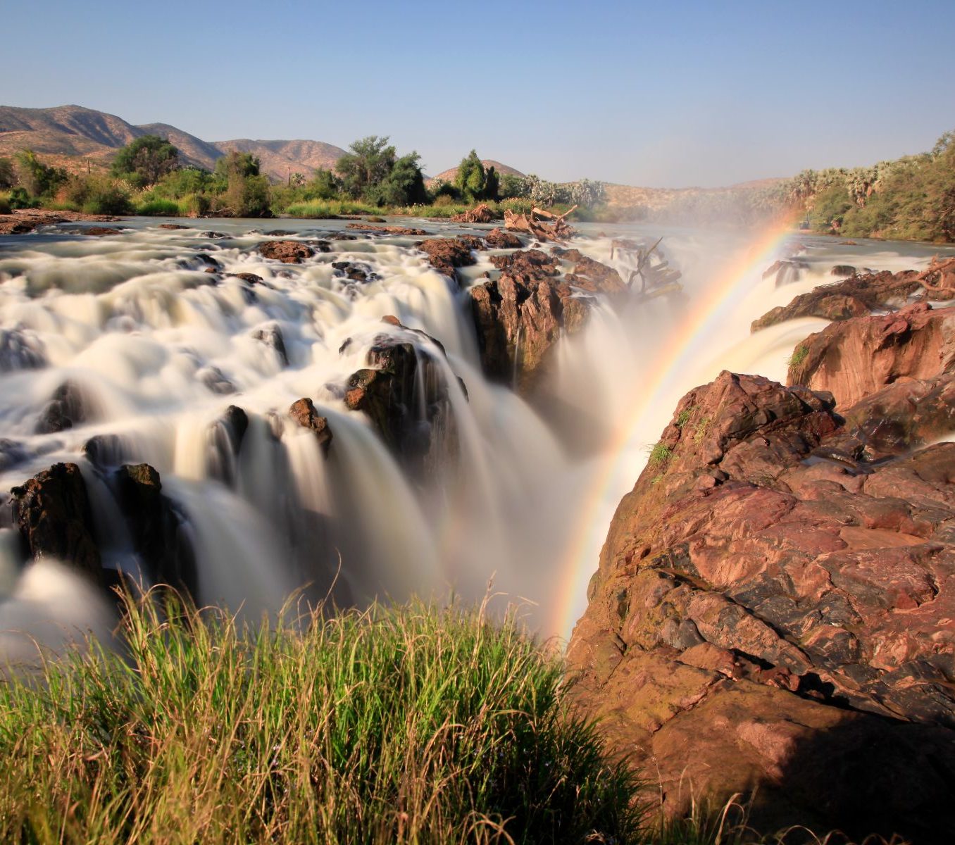Rondreis Namibië, Epupa Falls, waterval met regenboog