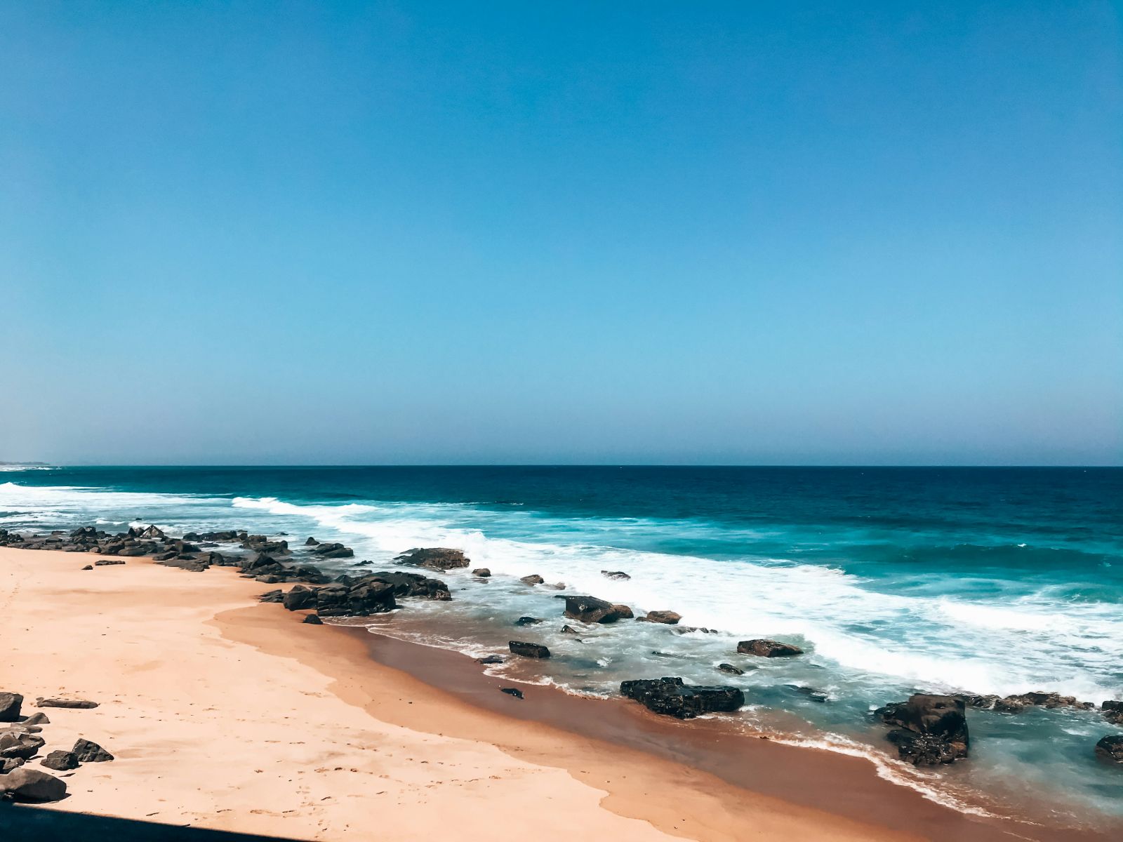 Rondreis Zuid-Afrika, Kwazulu-Natal, golven op het strand