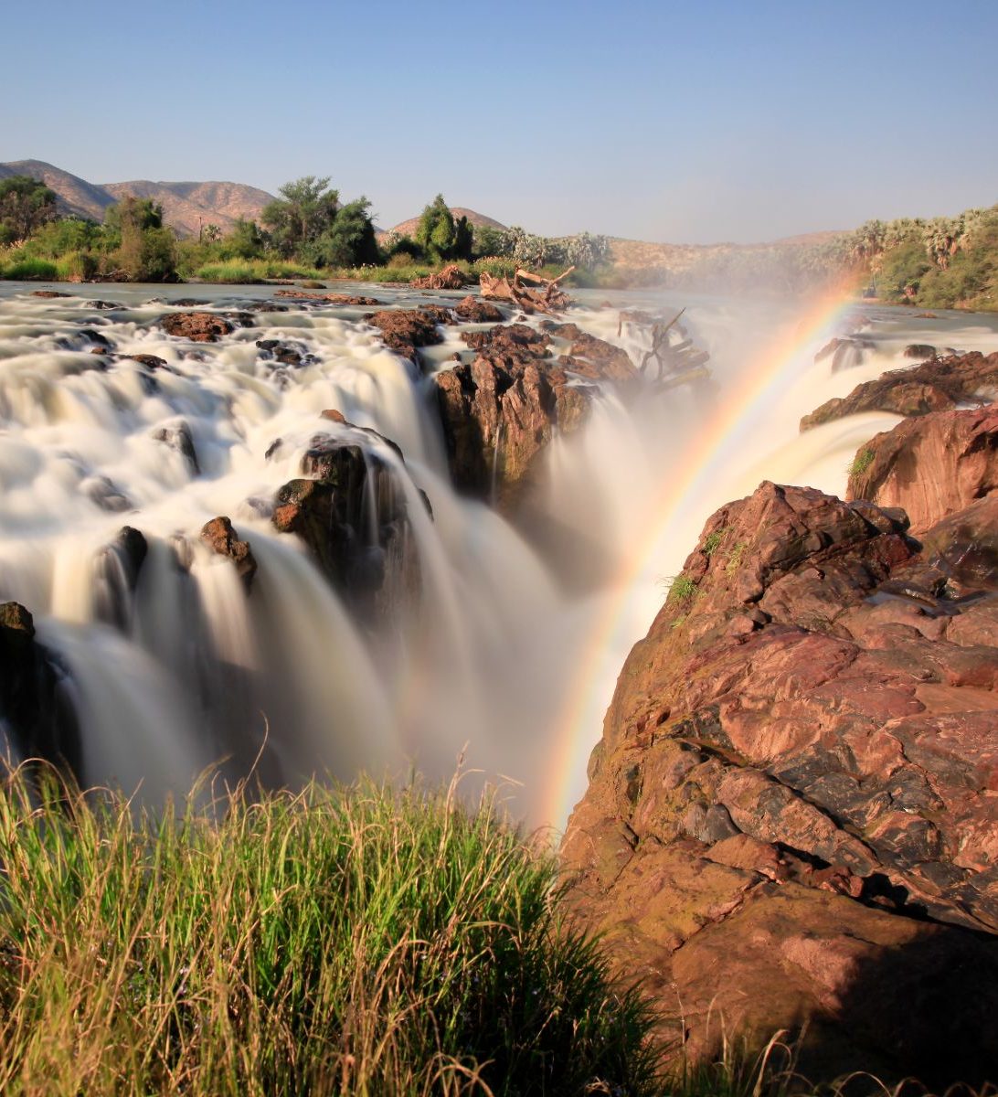 Rondreis Namibië, Epupa Falls, waterval met regenboog