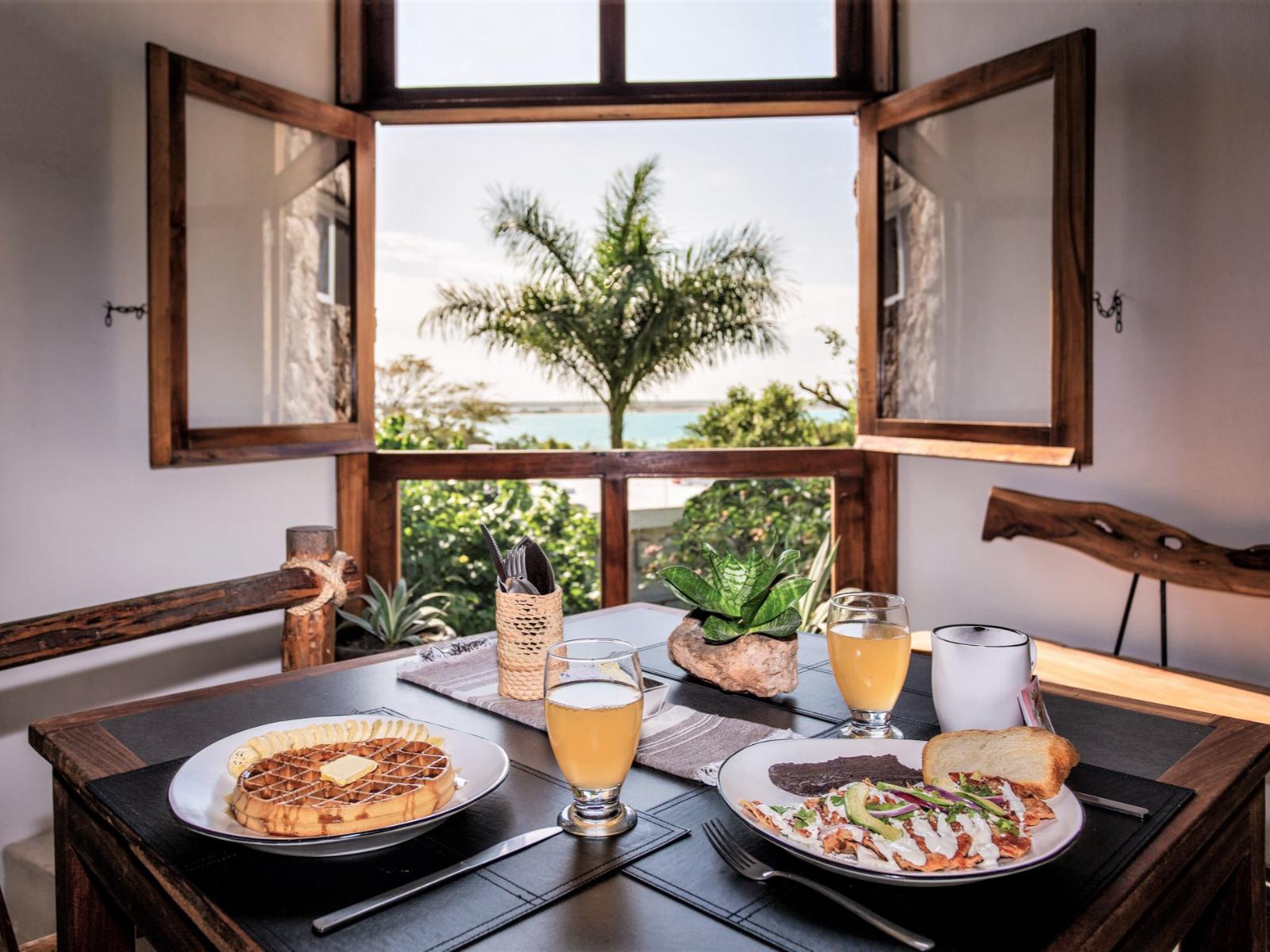rondreis mexico - bacalar - aires bacalar hotel - restaurant met uitzicht
