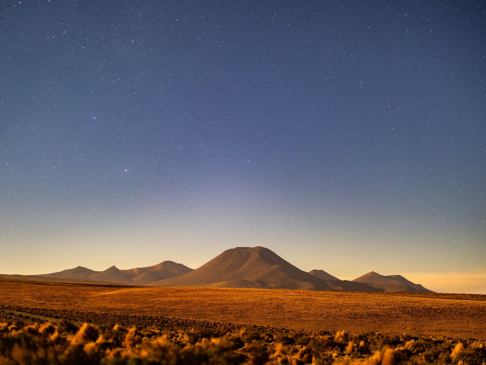 Rondreis Chili, San Pedro de Atacama, excursie sterrenkijken, landschap met zonsondergang