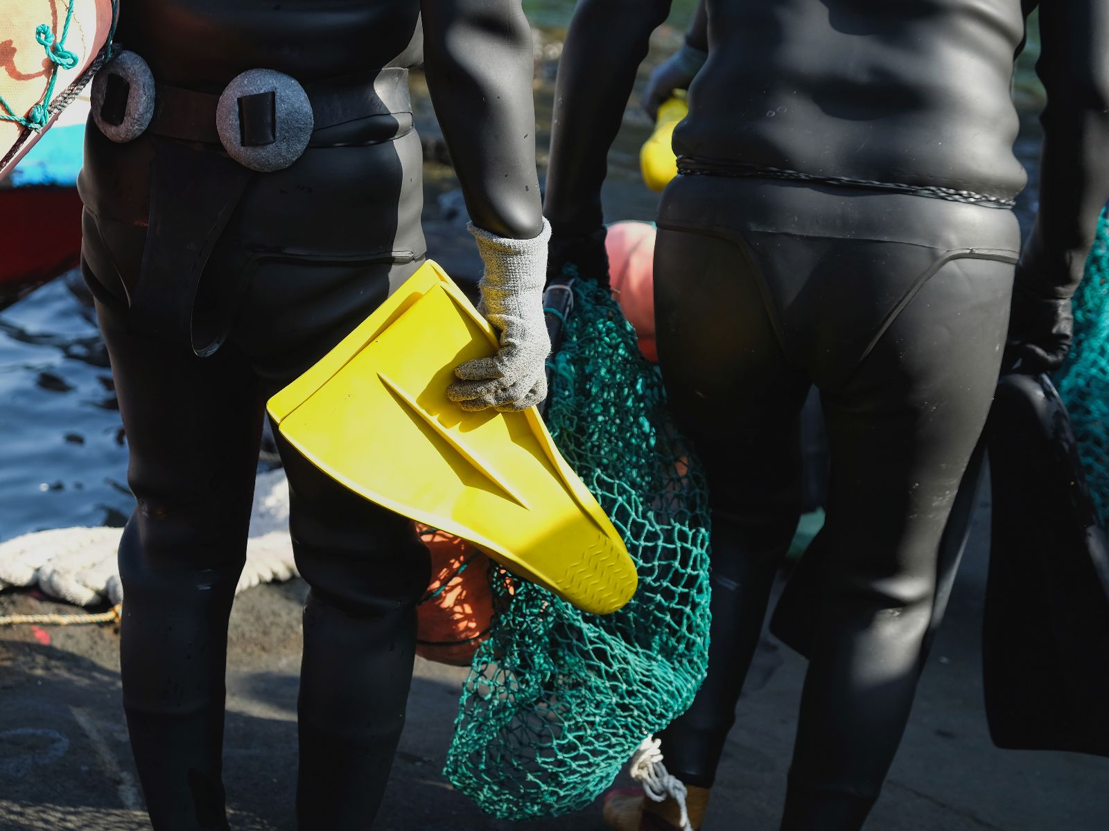 Rondreis Zuid-Korea, excursie Jeju Island oostkust, Haenyeo Woman Diver, vrouwelijke duikers met zwemvinnen en visnet
