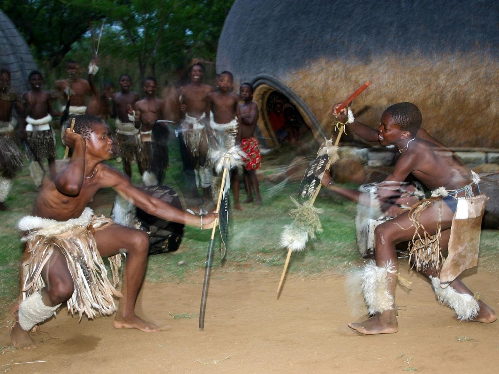 Rondreis Zuid-Afrika, St. Lucia, Zulu Village Tour, stok gevecht