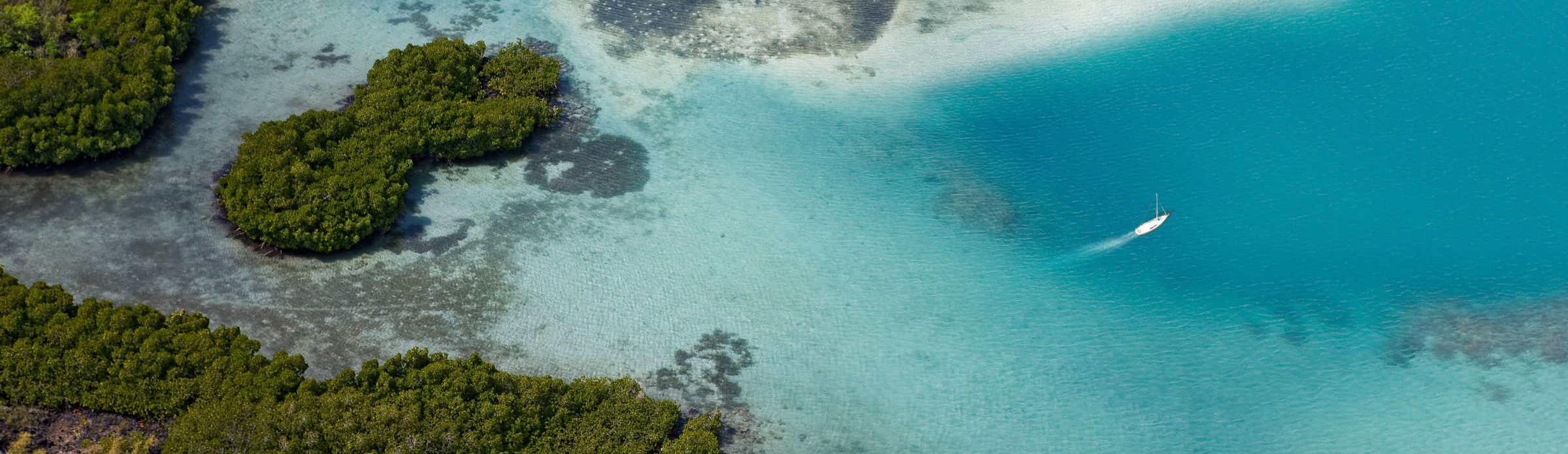 Rondreis Mauritius, bovenaanzicht boot en eiland, banner